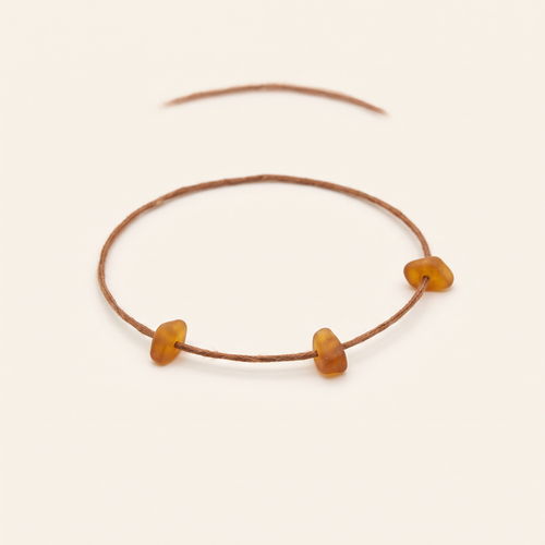 Thin minimalist bracelet with small amber chips