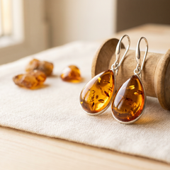 Amber drop earrings on linen